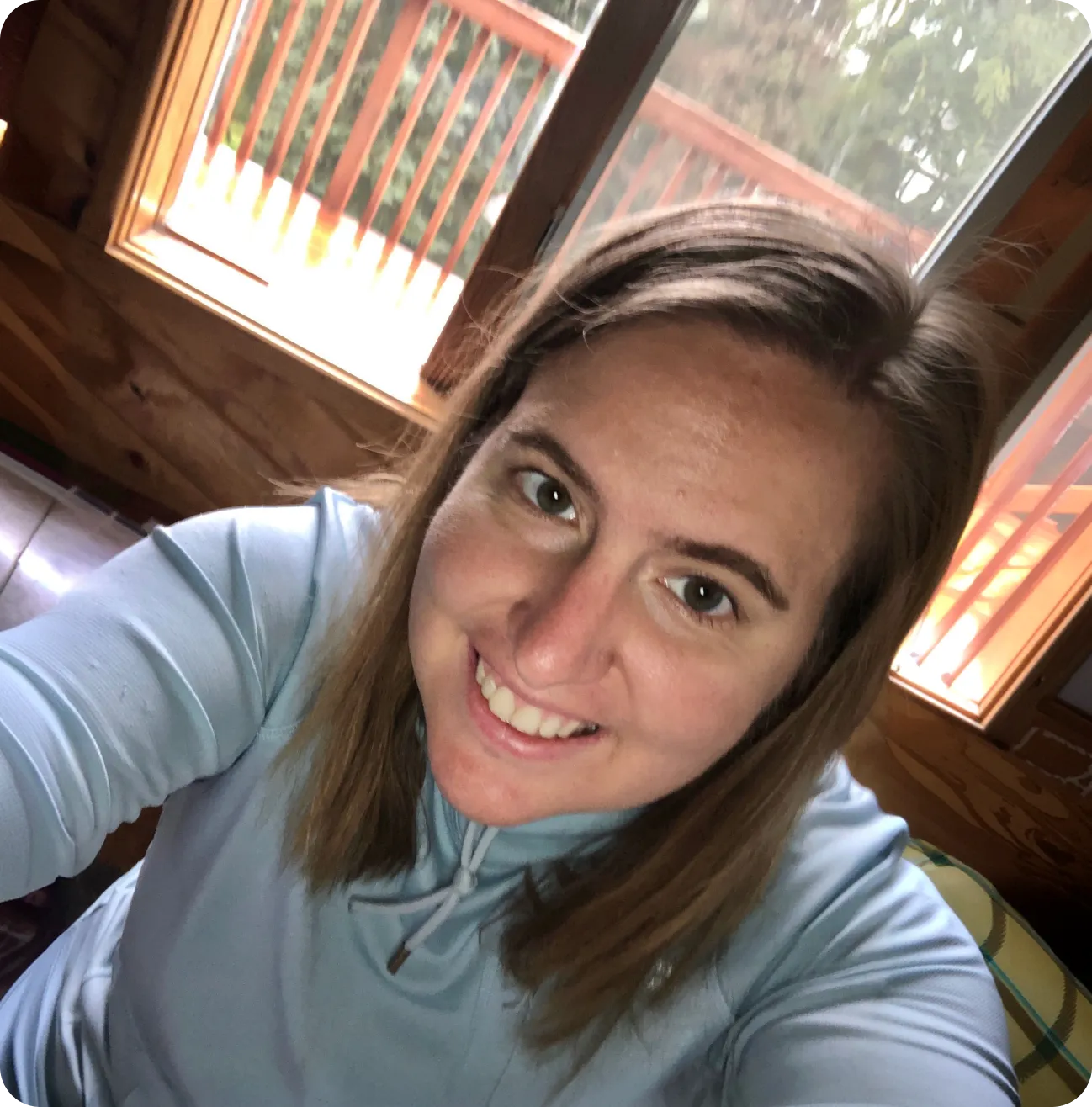 Joanna, founder of NorthStar Education, smiling in a wood-panelled room